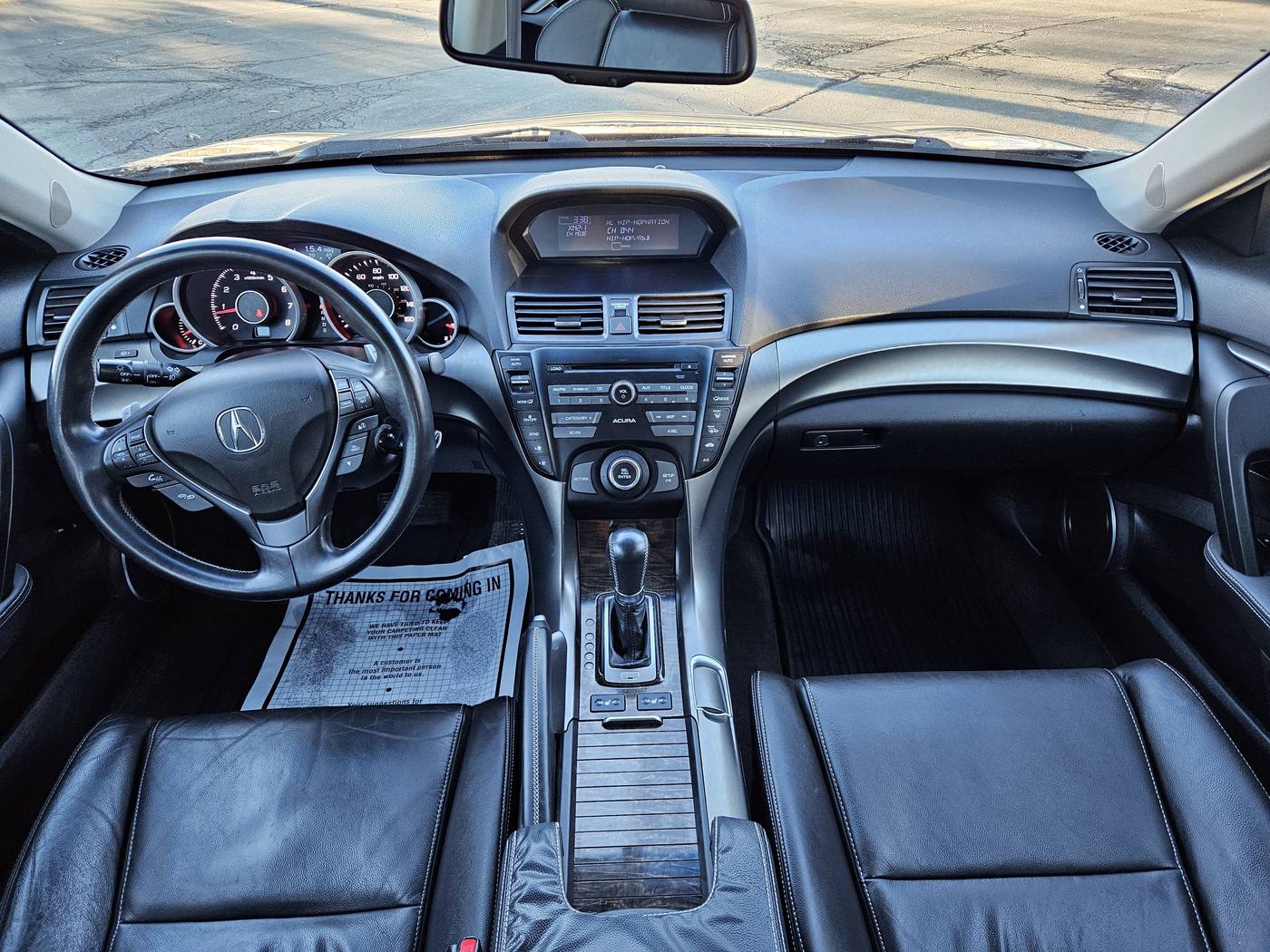 Sedan interior with cleaned leather and dash